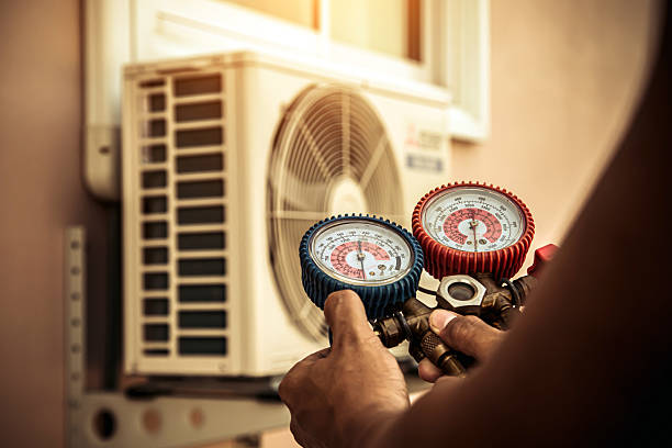 Professional Air Conditioning Service technician working in Wheeling, IL